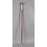 A 19th century walking cane with sword in carved fruitwood and ivory