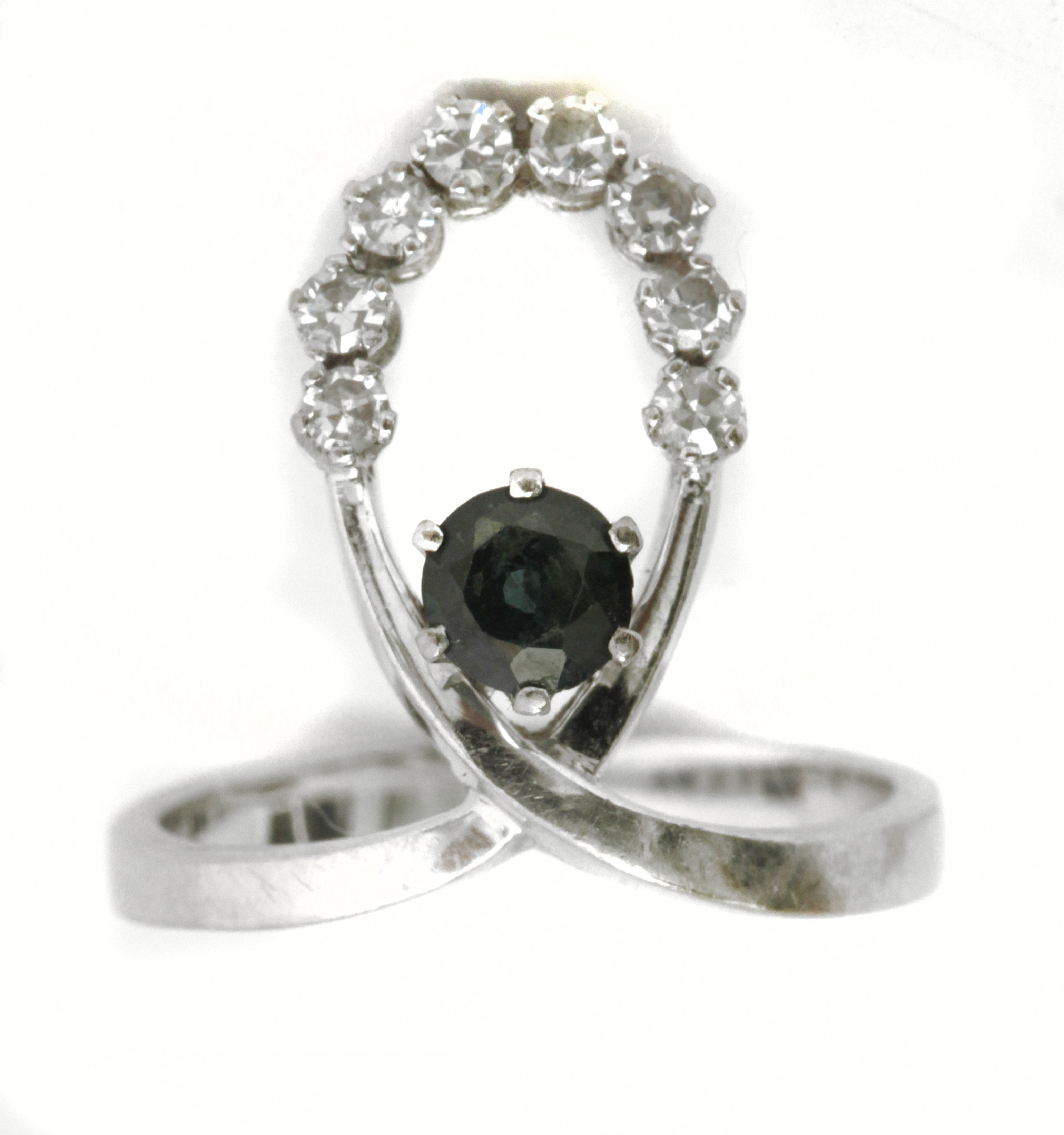 A sapphire and diamond ring circa 1960-1969 with an 18k. white gold setting