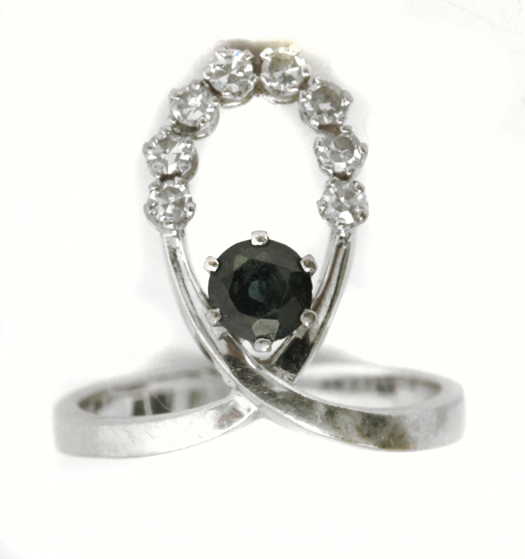 A sapphire and diamond ring circa 1960-1969 with an 18k. white gold setting