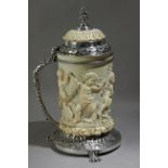 A second half of 19th century German tankard in carved ivory depicting putti