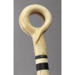 A carved bone and stag horn walking cane circa 1920