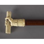 A 19th century American walking cane in carved cherrytree wood and ivory