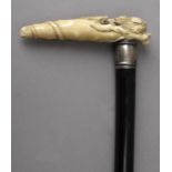 A 19th century walking cane, possibly English in ebony and ivory