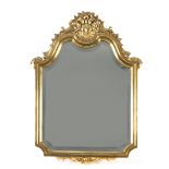 A 20th century Louis XV style mirror in carved and gilded wood