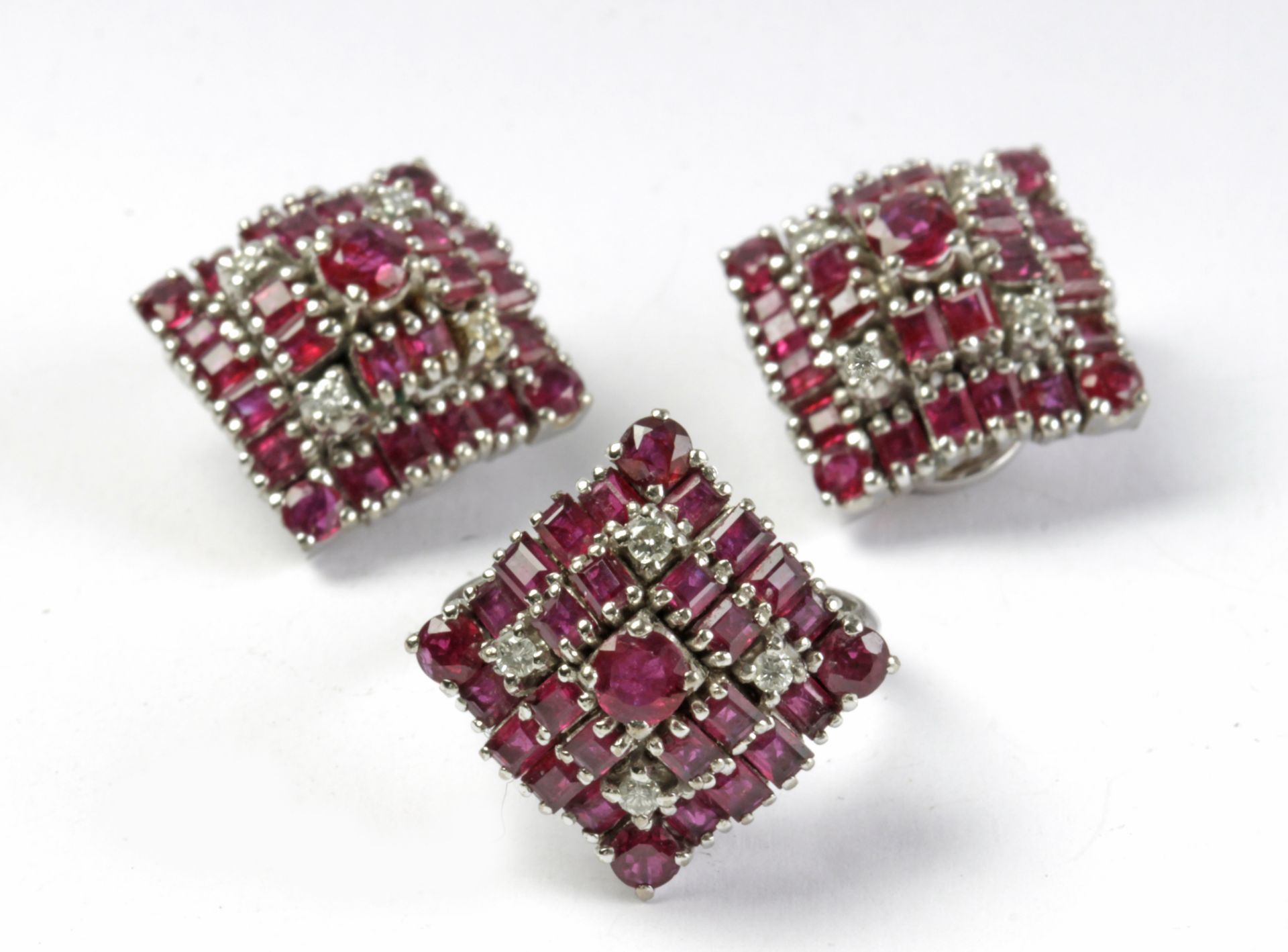 A ruby and brilliant cut diamonds set of ring and earrings circa 1960-1970 with a platinum setting