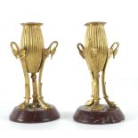 A pair of 19th century Empire period gilt bronze candelabras
