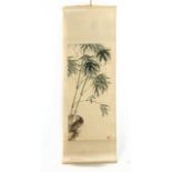 A 20th century Chinese scroll depicting green bamboo on cream silk