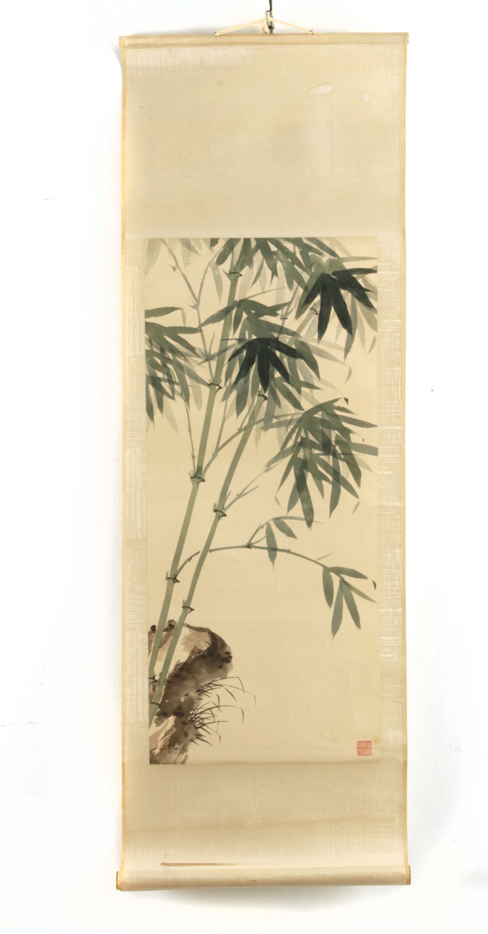 A 20th century Chinese scroll depicting green bamboo on cream silk