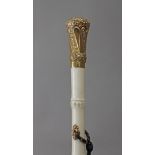 A first half of 20th century French baton in carved ivory and 18k. yellow gold