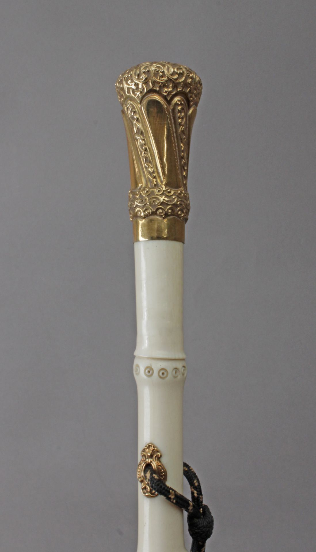 A first half of 20th century French baton in carved ivory and 18k. yellow gold