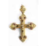 A sapphire, ruby and diamond pendant cross with an 18k., yellow gold setting
