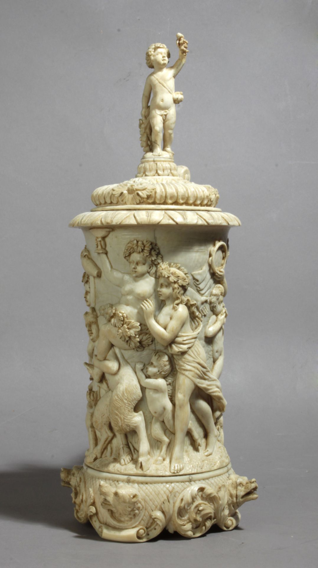 A 19th century German tankard in carved ivory depicting a Bacchanalia