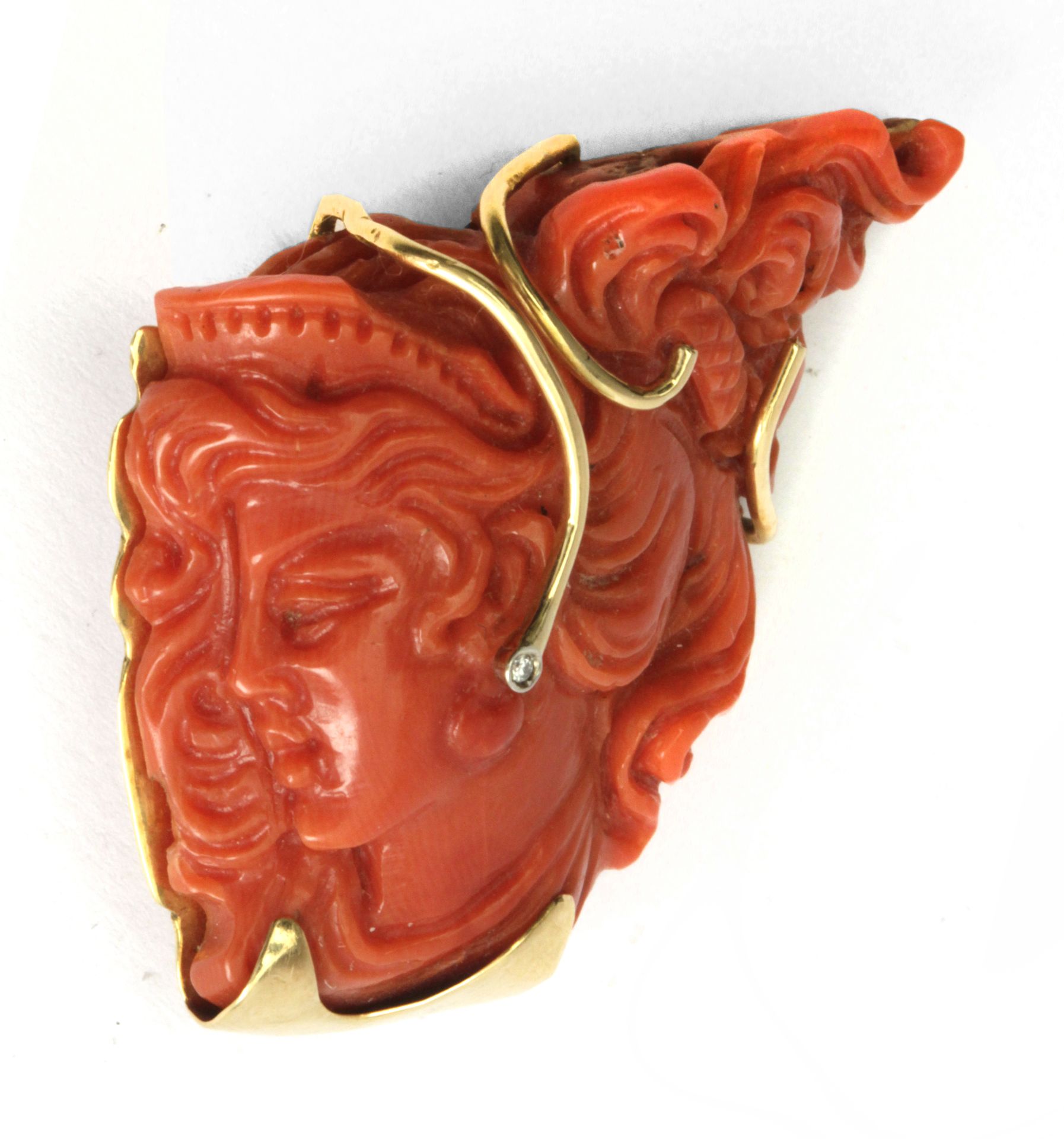 A red coral, diamond and gold pendant