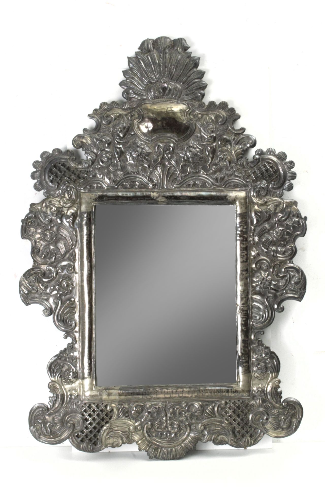 A second half of 19th century colonial mirror in embossed Mexican or Bolivian silver