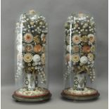 A pair of 19th century Isabelino glass domes with sea shells