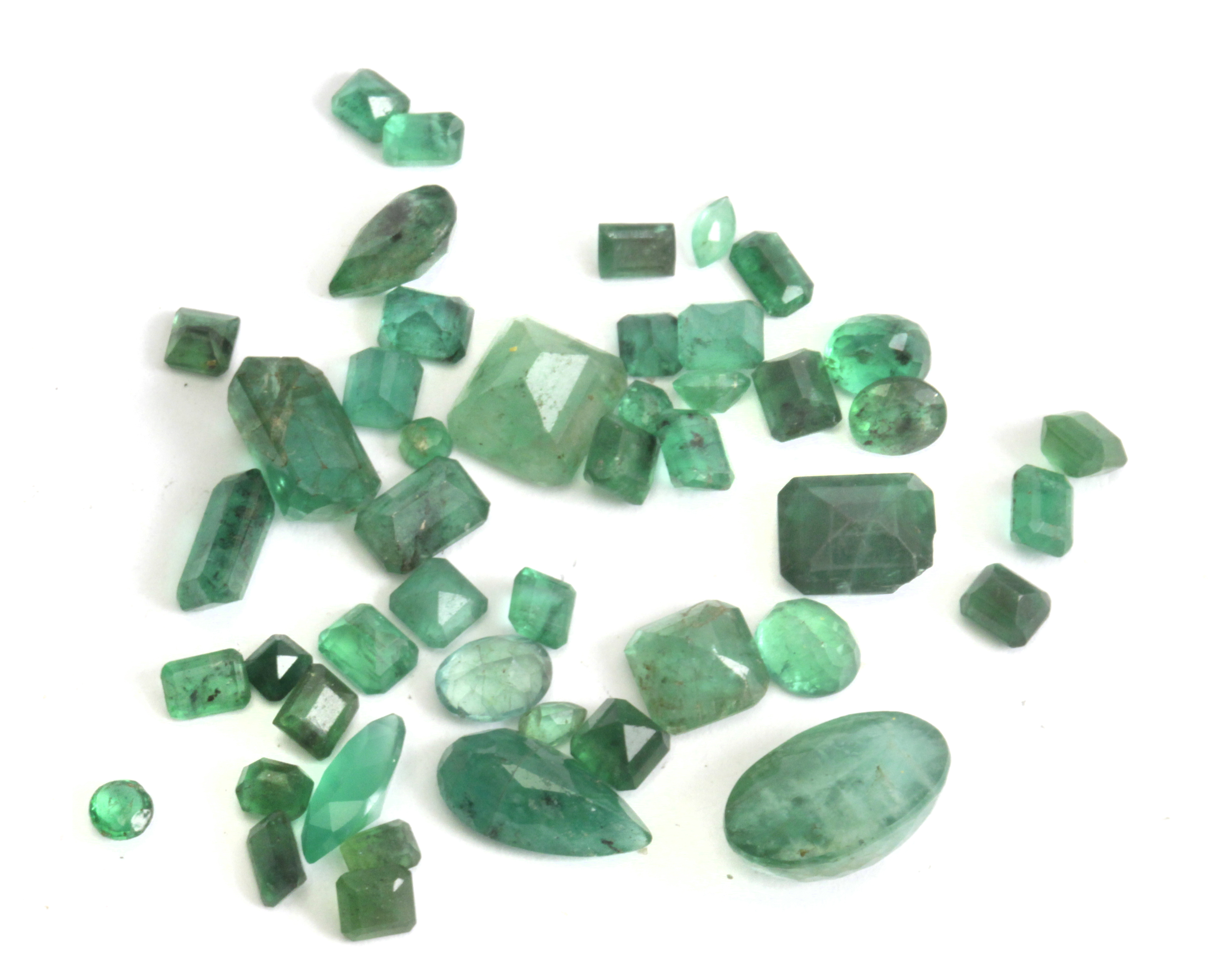 A collection of 46 loose emeralds