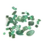 A collection of 46 loose emeralds