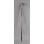 A first third of 20th century German walking cane in carved wood, tortoiseshell and silver