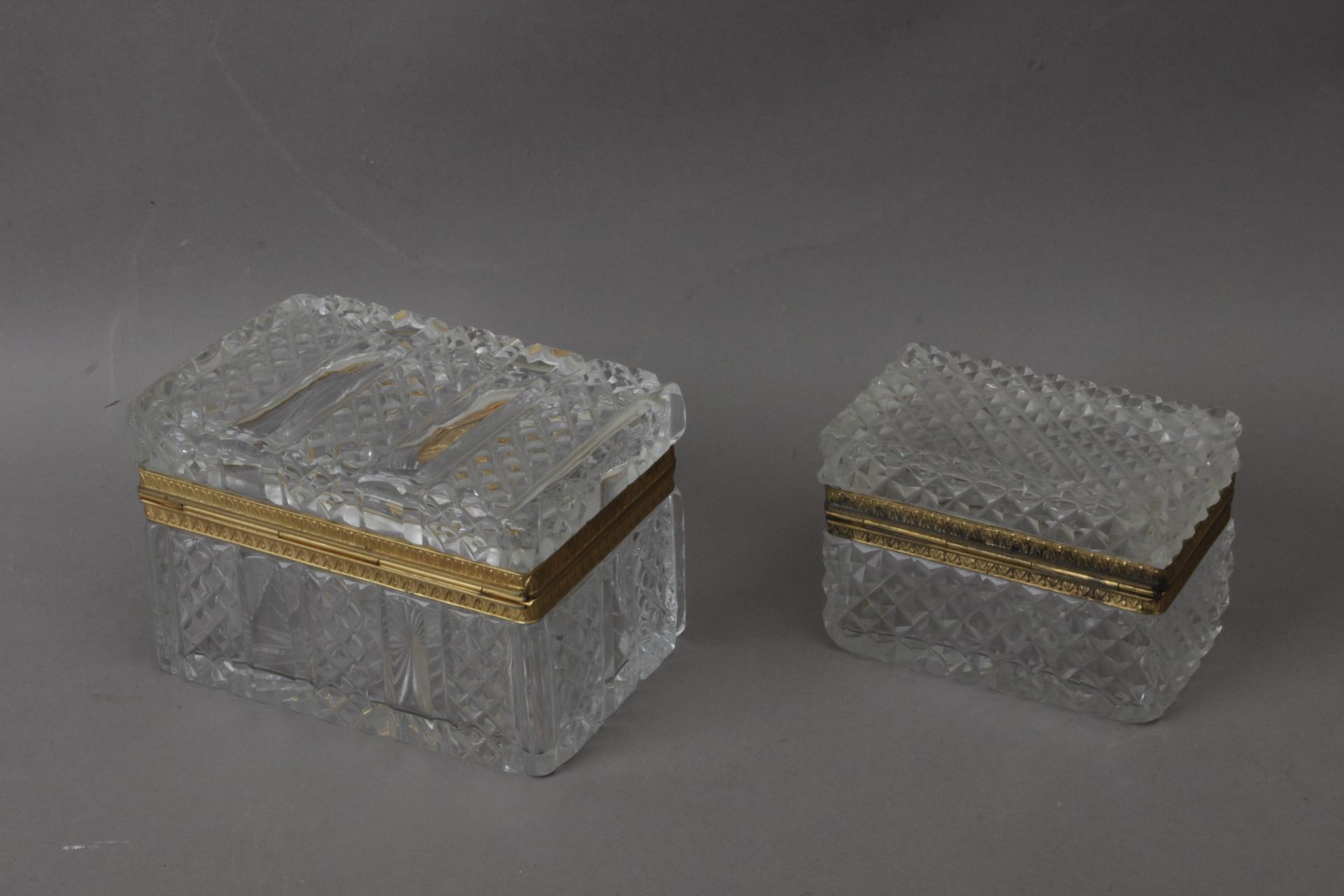 A pair of 19th century cut glass and ormolú bronze jewellery boxes from Empire period
