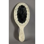 A 19th century Indian mirror in carved ivory