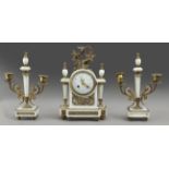 Olivella & hermanos. An Empire style mantel clock garnished with candelabras circa 1900