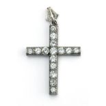 A brilliant cut diamond pendant cross in an 18k. white gold setting