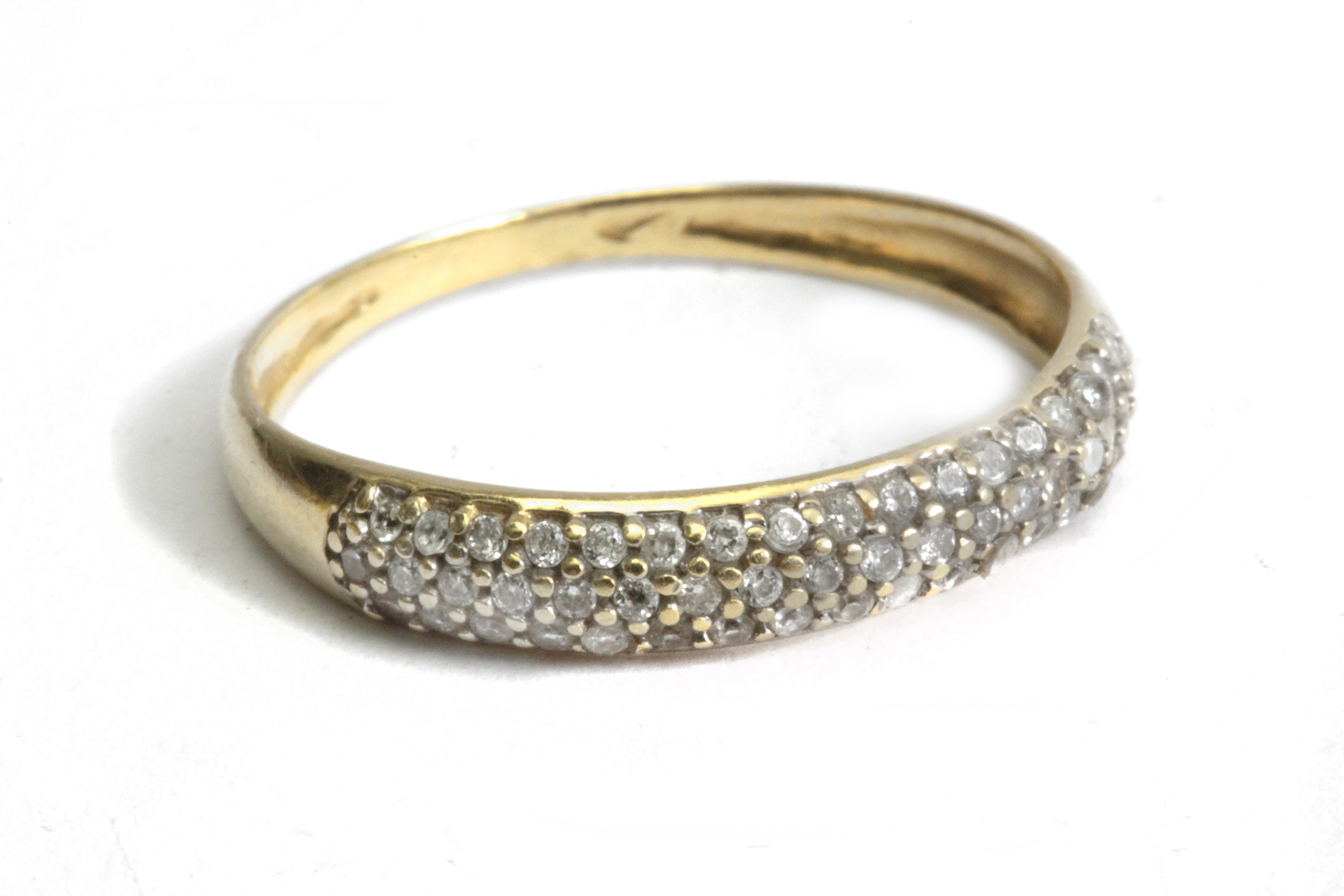 A diamond pave half eternity ring