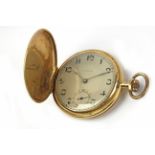Universal. An 18k. yellow gold double hunter pocket watch circa 1920-1940