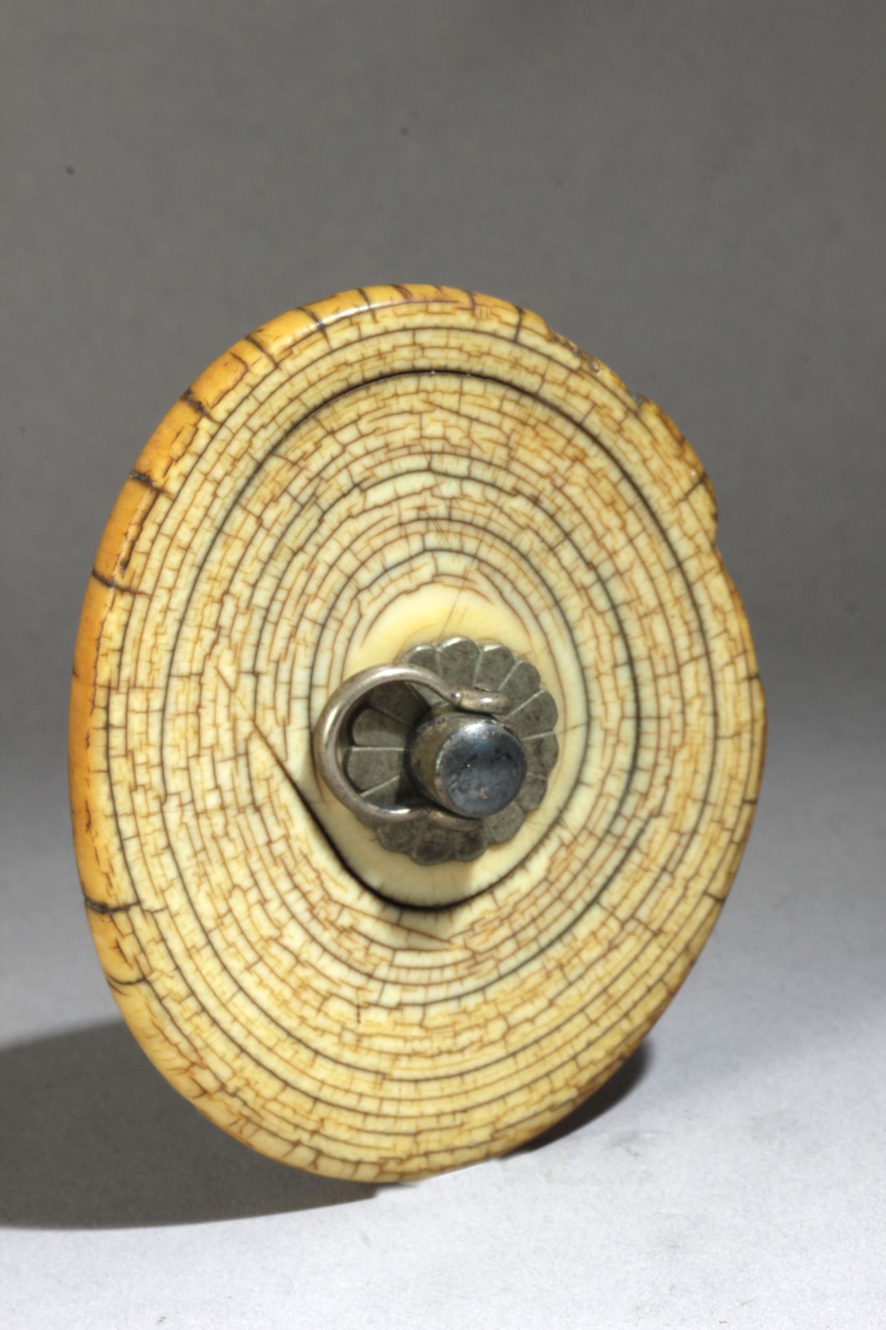 A 17th-18th centuries Japanese manju-disc in carved mammooth ivory