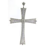 A diamond and platinum pendant cross