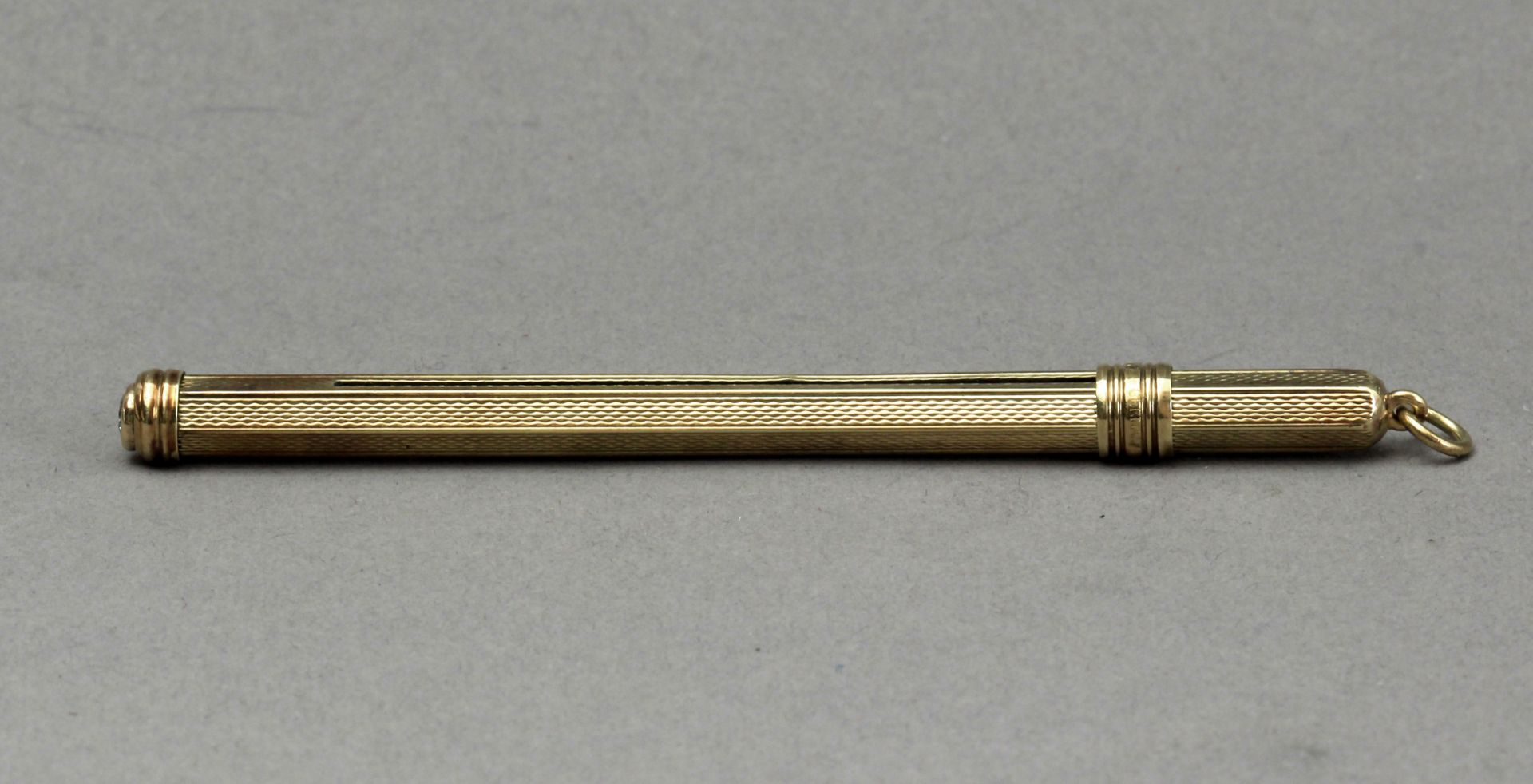 A mid 20th century 14k. yellow gold and diamond cocktail mixer tool