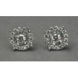 A pair of diamond stud earrings