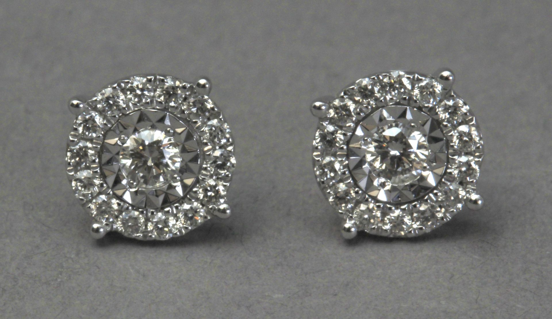 A pair of diamond stud earrings