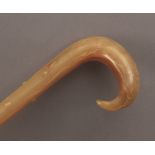A 19th century walking cane in carved horn