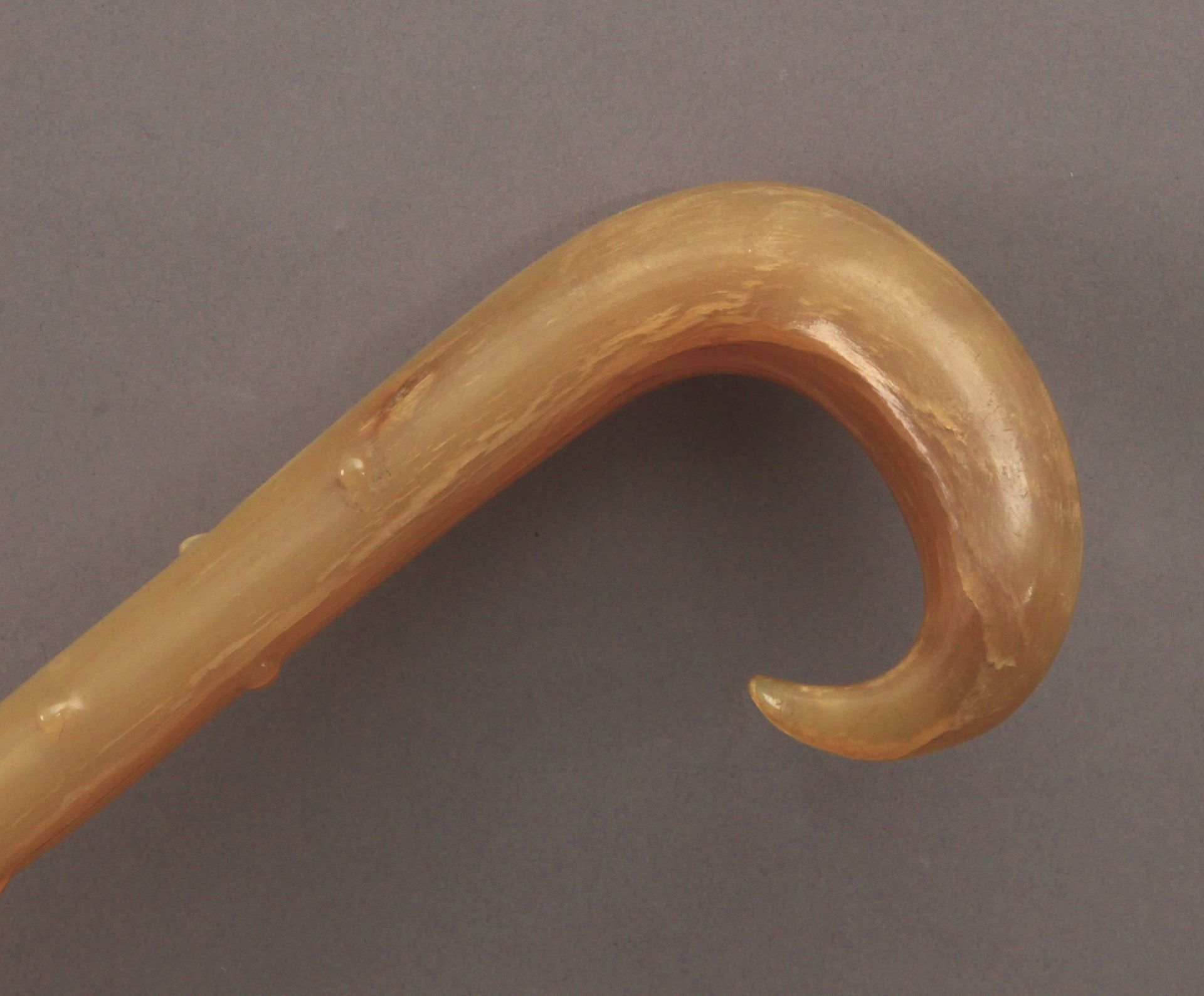 A 19th century walking cane in carved horn