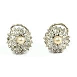 A pair of pearl and diamond cluster earrings