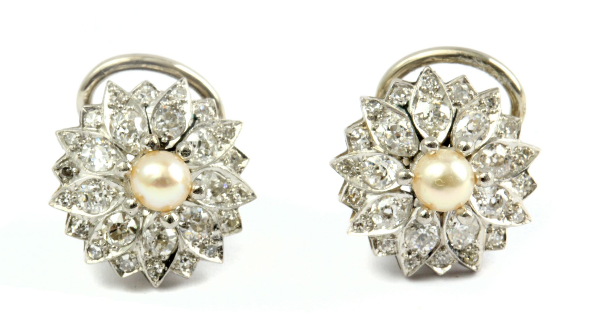 A pair of pearl and diamond cluster earrings