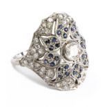 A diamond and natural sapphires bombé ring