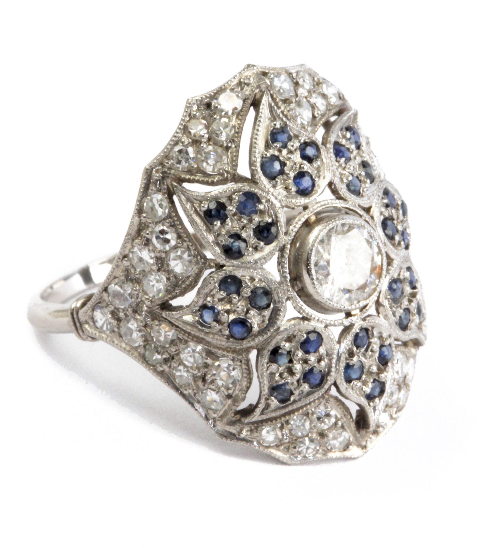 A diamond and natural sapphires bombé ring