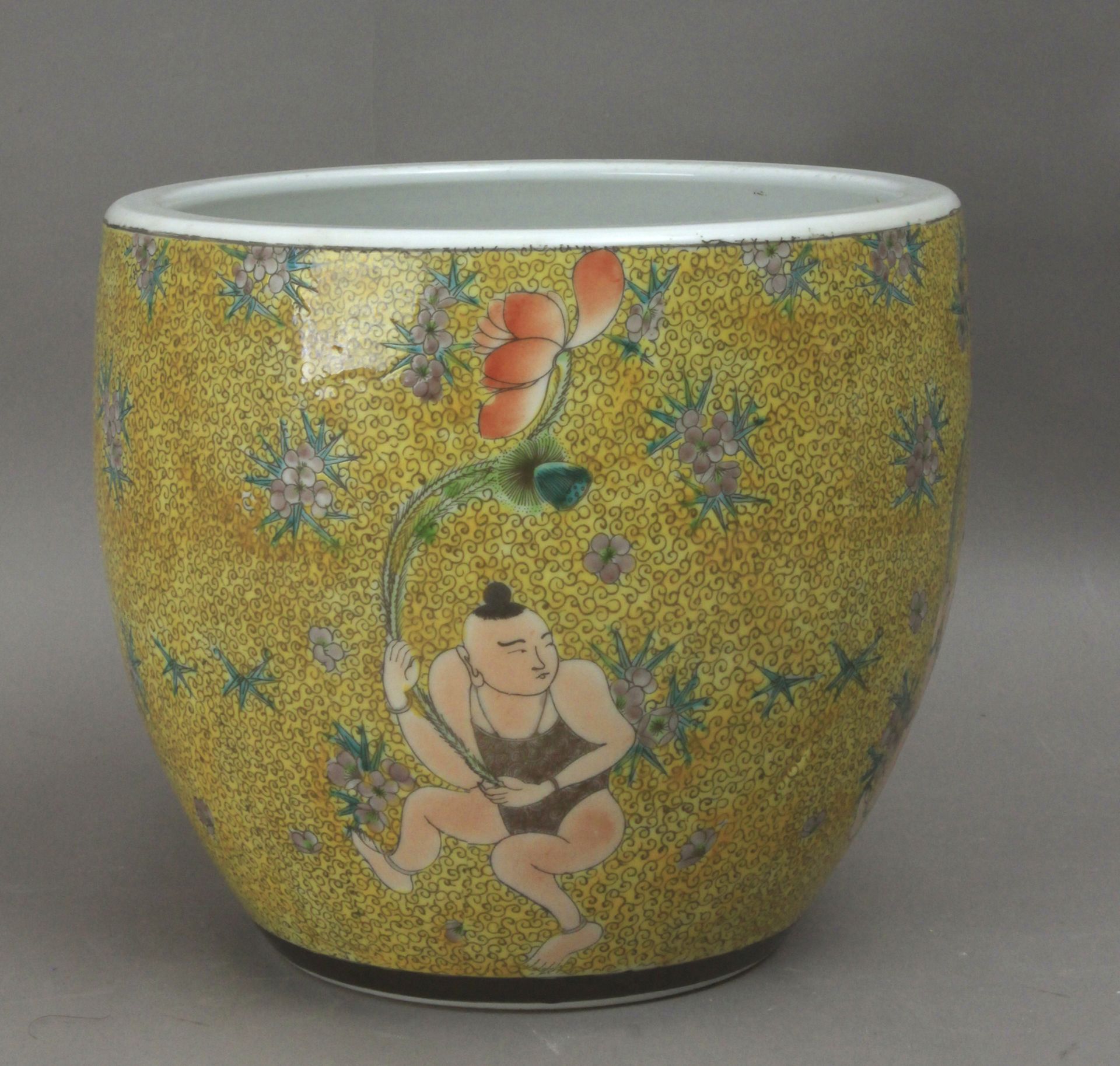 A 19th century Chinese cache pot in Famille Rose porcelain