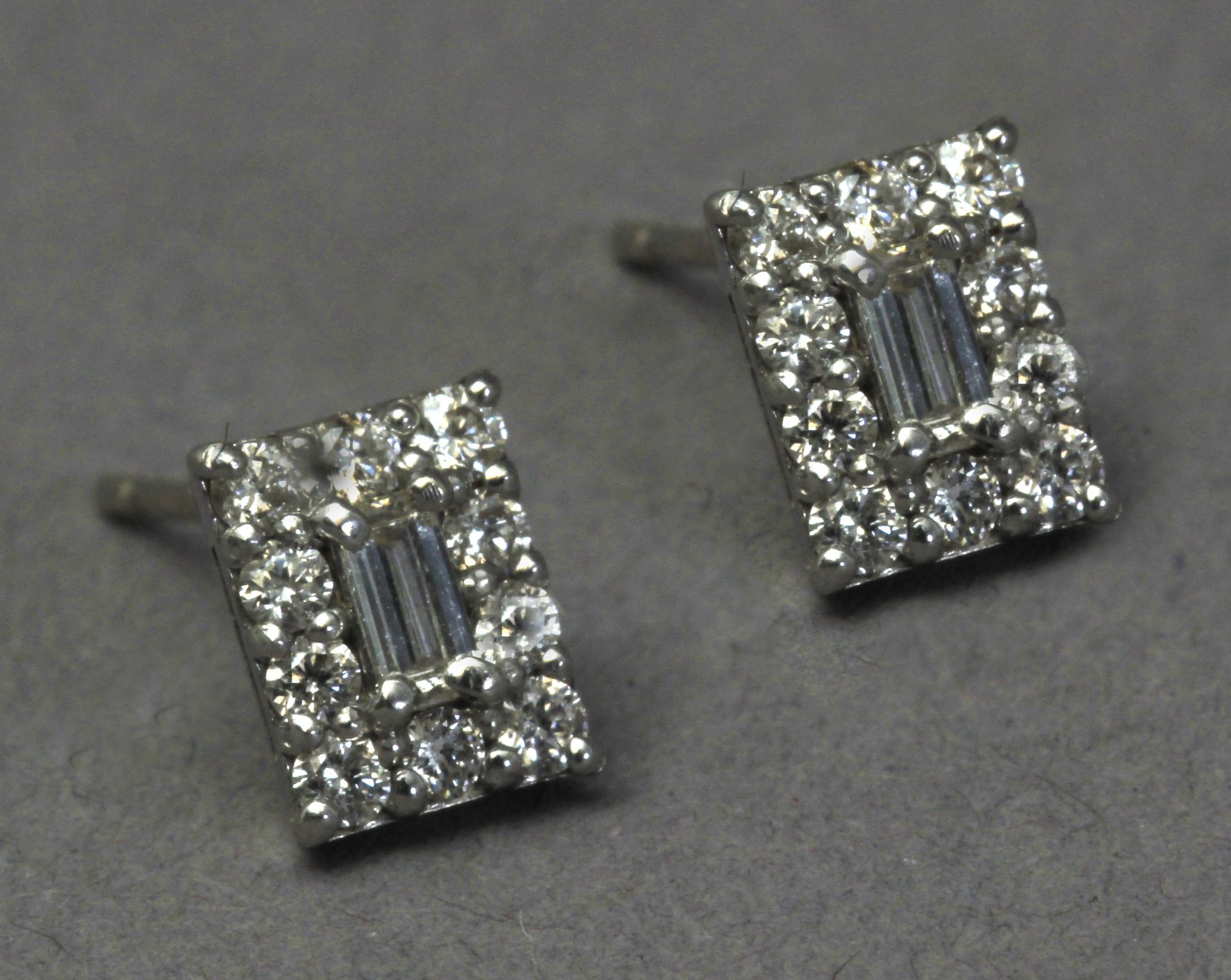 A pair of diamond stud earrings