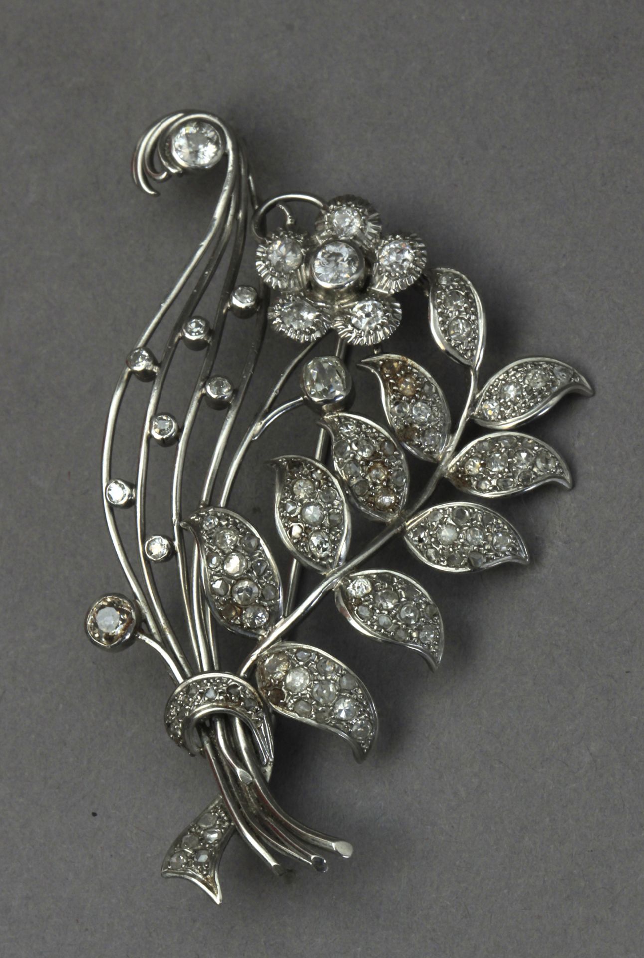 A mid 20th century diamond and platinum flowery brooch