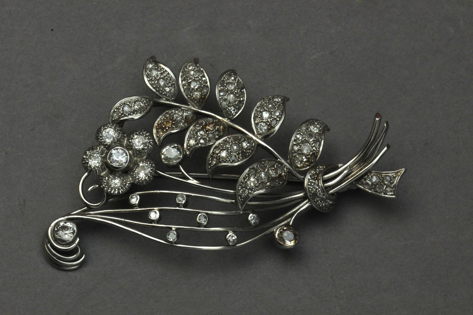 A mid 20th century diamond and platinum flowery brooch - Image 2 of 3