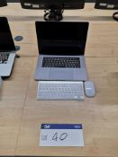 Apple MacBook Pro, with keyboard and mouse