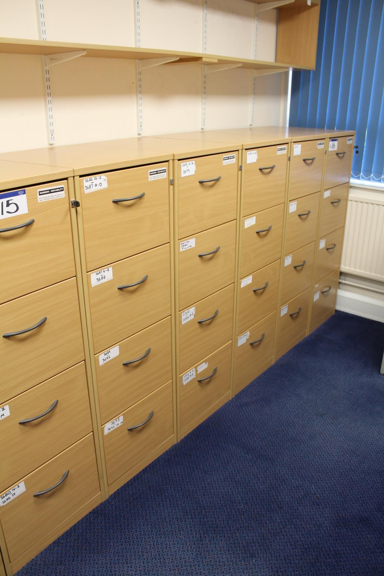 Five Light Oak Veneered Four Drawer Filing Cabinets