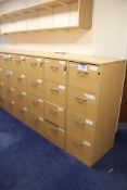 Four Light Oak Veneered Four Drawer Filing Cabinets