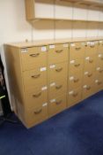 Four Light Oak Veneered Four Drawer Filing Cabinets