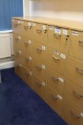 Five Light Oak Veneered Four Drawer Filing Cabinets