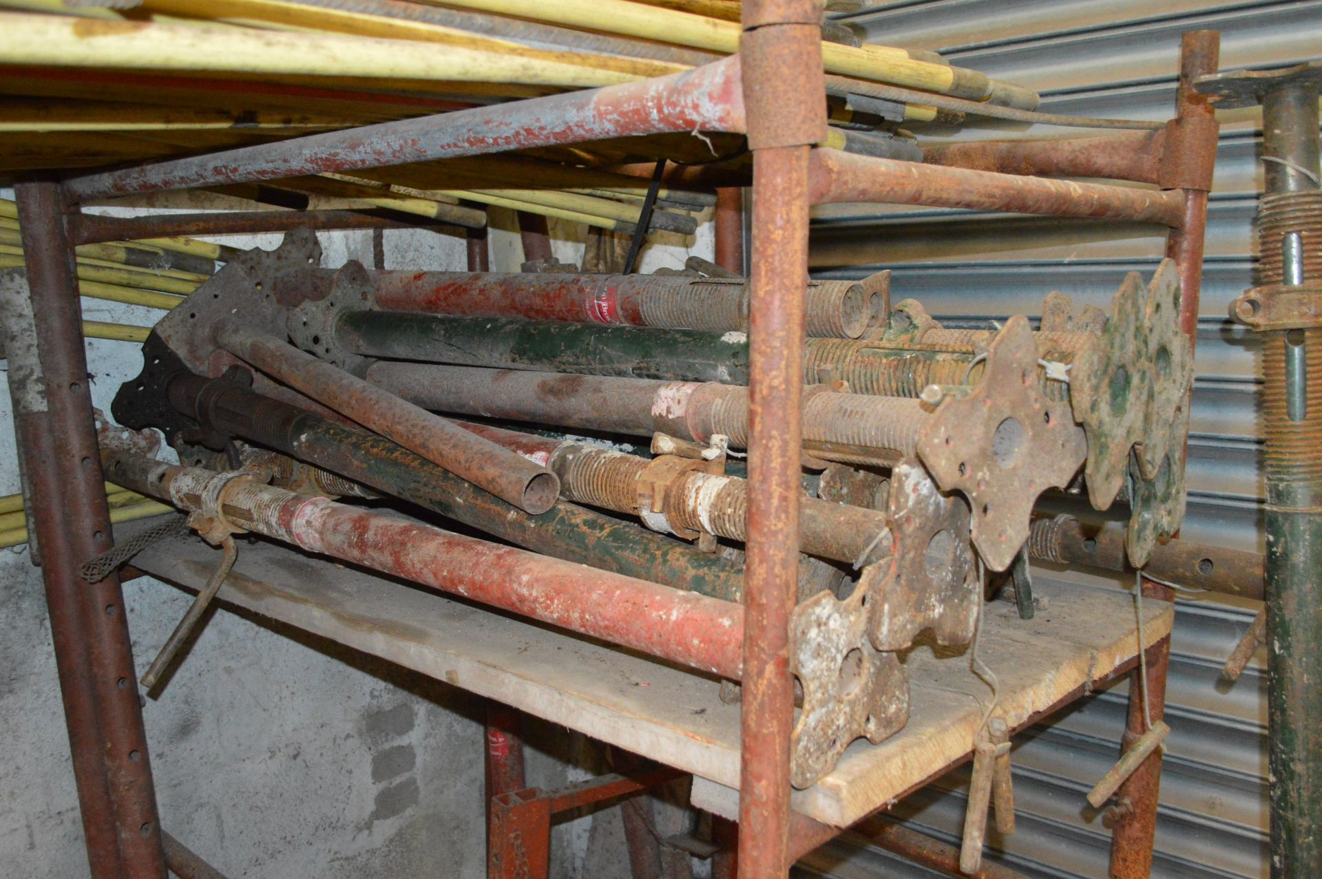 Assorted Acro Props, as set out on shelving unit