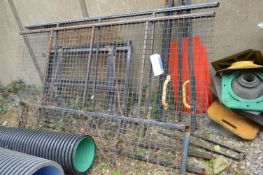 Wire Mesh Fence Panels, as set out against wall